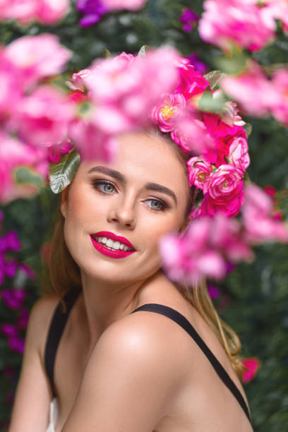 istock Beautiful woman with flowers wreath 932109186