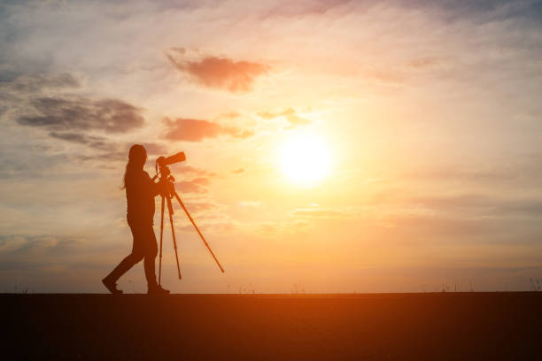 Binoculars on yellow background