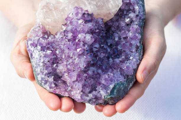 istock A large beautiful piece of amethyst in hands 932111550