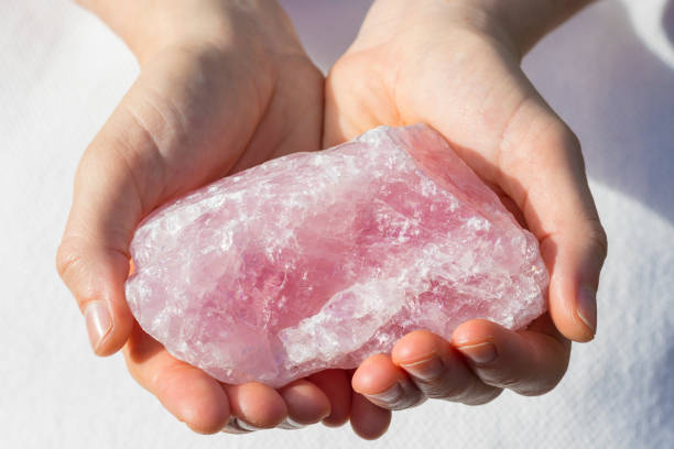 istock Beautiful Large Piece of Rose Quartz in Hands 932111598