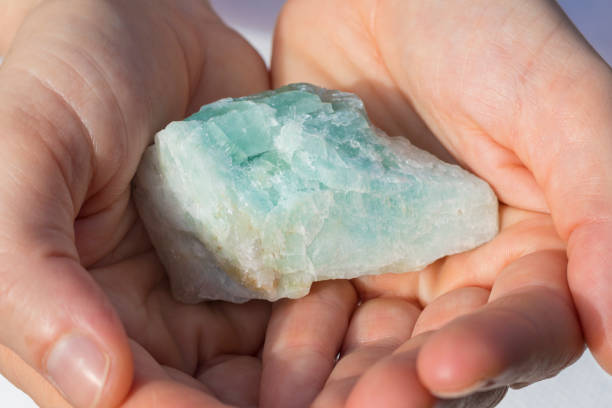 istock A beautiful large piece of Aquamarine in hands 932111676