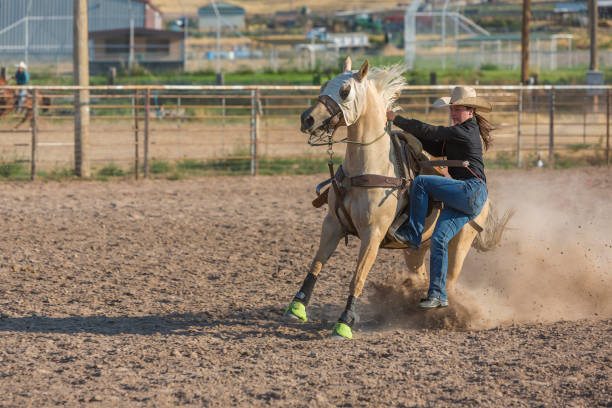 istock Goat Tying Young Women at a Dusty Rodeo 932117514