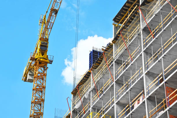 istock Crane and highrise construction site 932120164