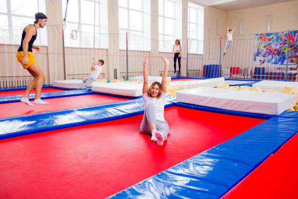 istock Family in trampoline center 932120490