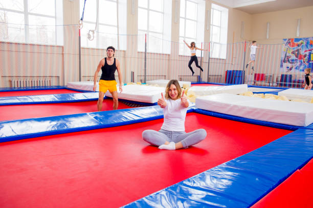 istock Family in trampoline center 932120502