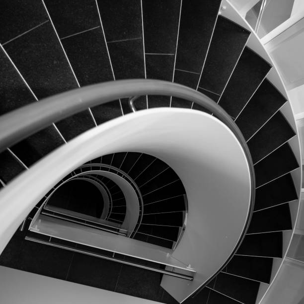 istock spiral stairway in black and white 932121074