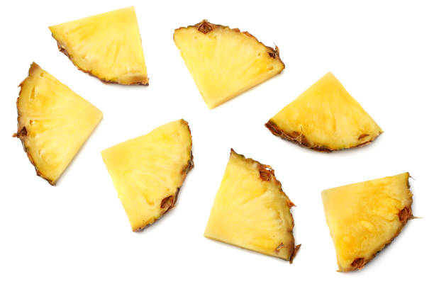 istock healthy background. pineapple slices isolated on white background top view 932121274