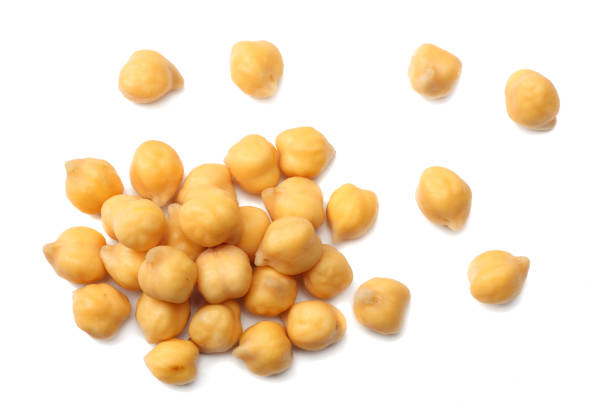 istock chickpeas isolated on white background. top view 932121298