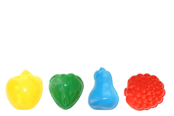 istock Baby multicolor plastic molds in the form of fruit on a white background 932121838