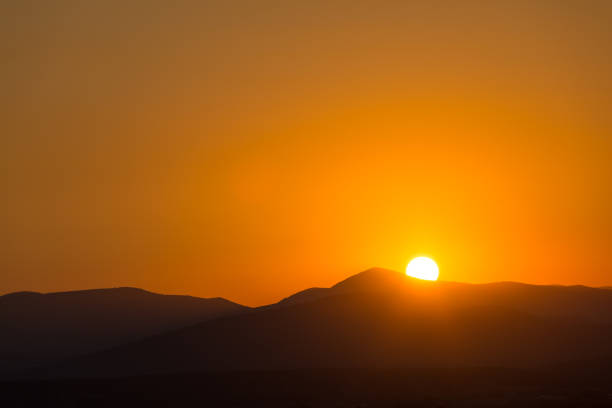 istock Scenic view of a beautiful sunset 932121938