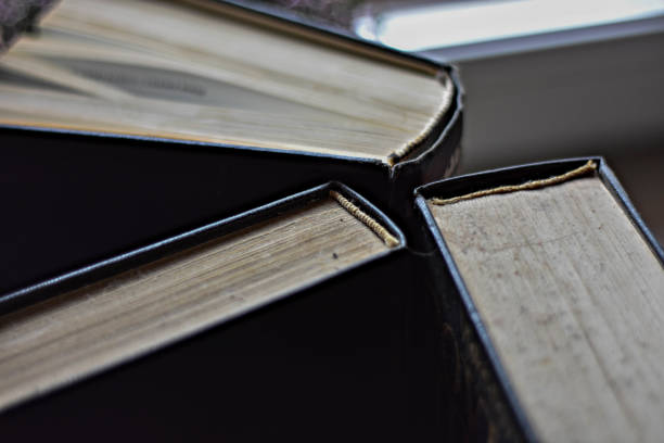 istock Stack of old dusty books viewed from the top 932121986