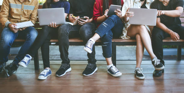 istock young people being used computer and tablet. 932124344