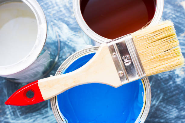 istock House renovation concept, paint cans and brushes 932124878