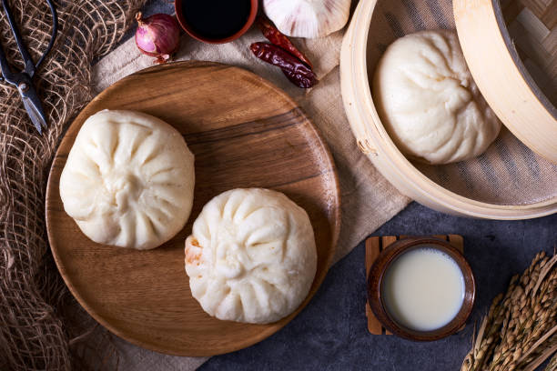 istock Chinese breakfast: Steamed buns (Baozi), fried breadsticks (yout 932129422