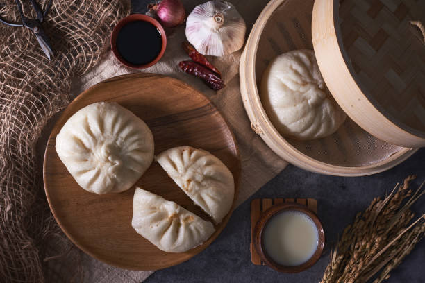 istock Chinese breakfast: Steamed buns (Baozi), fried breadsticks (yout 932129826
