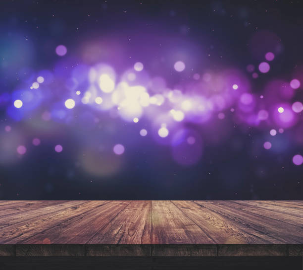 istock Wood table top with blurred light colourful bokeh abstract background 932133952