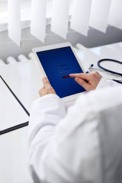 istock Male doctor with digital tablet 932134142