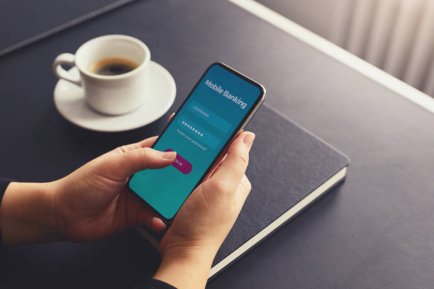 istock Female hands sign up for banking with a mobile phone 932136436