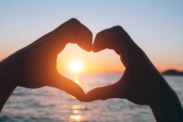 istock Male hands in a heart shape 932136560