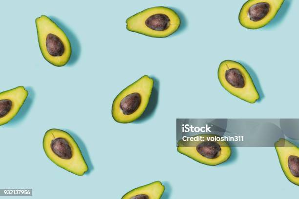 Avocado On The Blue Background Top View Stock Photo - Download Image Now - Avocado, Pattern, Blue