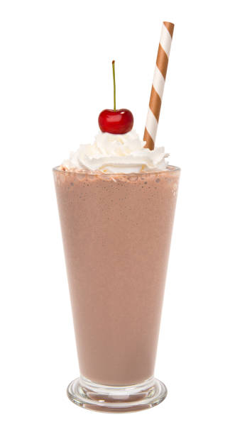 vanilla chocolate milkshake with whipped cream and cherry isolated stock photo