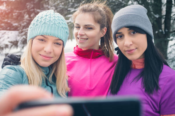 istock Young Women Jogging At Winter Time 932145000