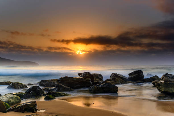 istock Hazy Sunrise Seascape 932145020