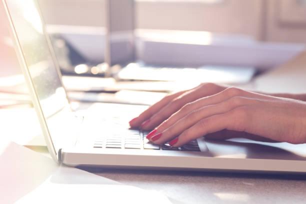 istock Architect working on a laptop in the sunny office. 932145506