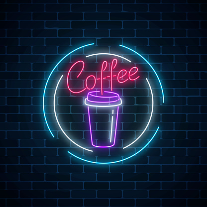 Glowing neon coffee cup sign on a dark brick wall background. Night advertisement symbol of coffee. Cafe or vendor machine emblem. Vector illustration.