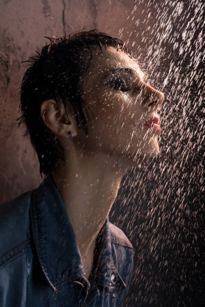 istock Beautiful brunette in jeans shirt having shower 932149610