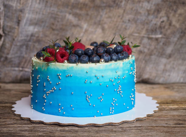 istock home pale blue cake with blueberries and raspberries 932149788