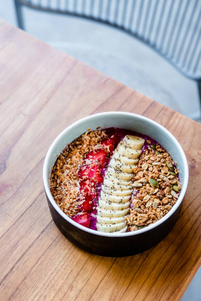 istock Berry smoothie bowl on wooden table 932157182