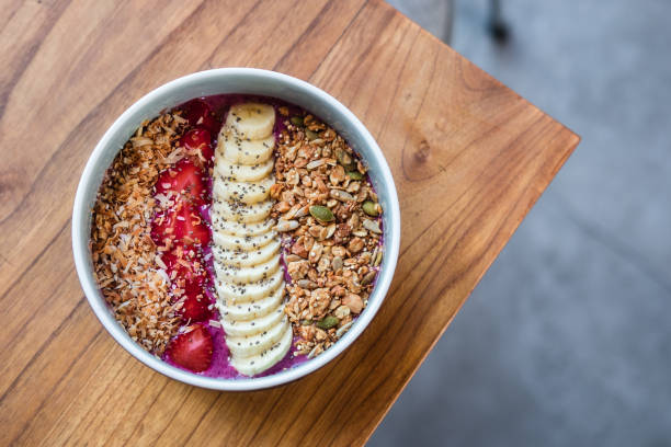 Berry smoothie bowl on wooden table