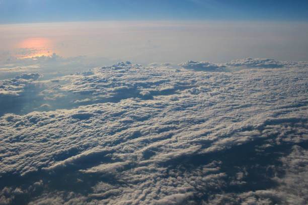 istock View above the earth at the clouds below 932157848