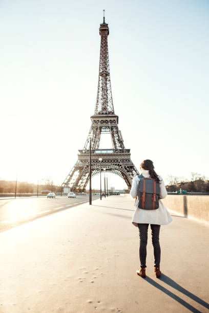istock Woman walking to the Eiffel tower 932160988