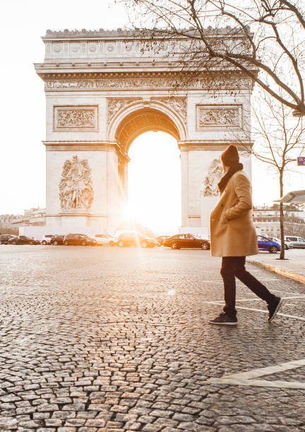 istock Man walking in front of Arc de Triomphe 932161042