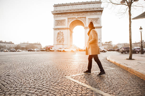istock Man walking in front of Arc de Triomphe 932161108