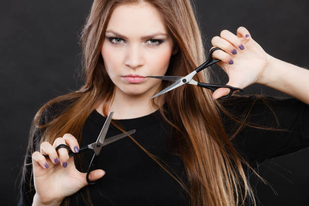 istock Female hairstylist barber with scissors. 932161466