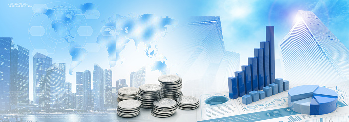coins and bar graph and charts in a blue cityscape background