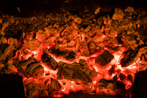 Photo of hot sparking live-coals burning in a barbecue
