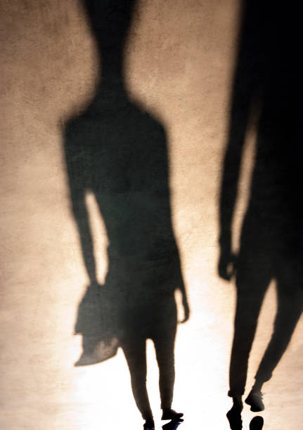 istock Blurry shadows silhouettes of people walking 932165836