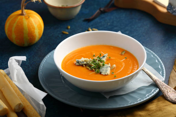 istock Pumpkin Cream soup with cheese, food closeup 932169616