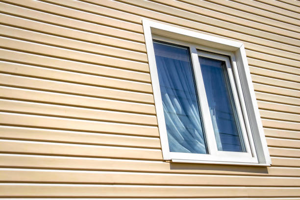 The window of a private house Window of a private house on a background of beige siding. shunting yard stock pictures, royalty-free photos & images