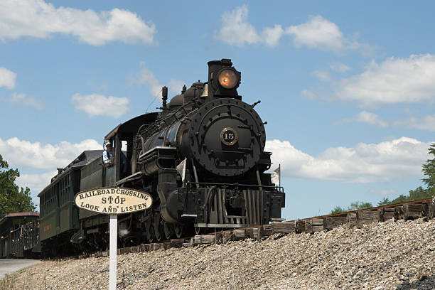 istock Train Crossing Road with Steam Locomotive, Low Angle 93218754