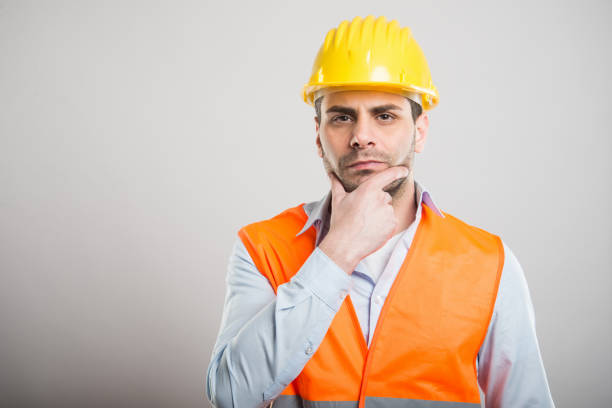 istock Portrait of attractive architect making thinking gesture 932192386