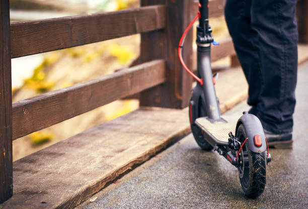 istock Electric scooter stands on a bridge in the street. 932201750