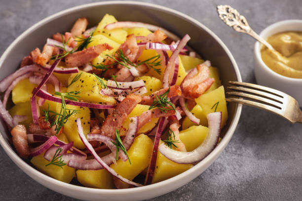 istock Potato salad with bacon, red onion and mustard sauce. 932202830
