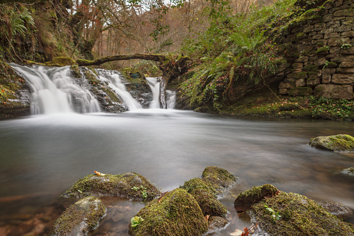 Waterfall in the river Pisueña, in the Pasiegos Valleys, Cantabria. Long exposure photography.