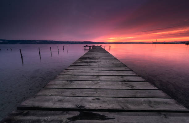 istock Colors of sunset and the old rusty pier 932208368