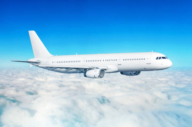 istock Passenger airplane fly on a hight above overcast clouds and blue sky. 932212070